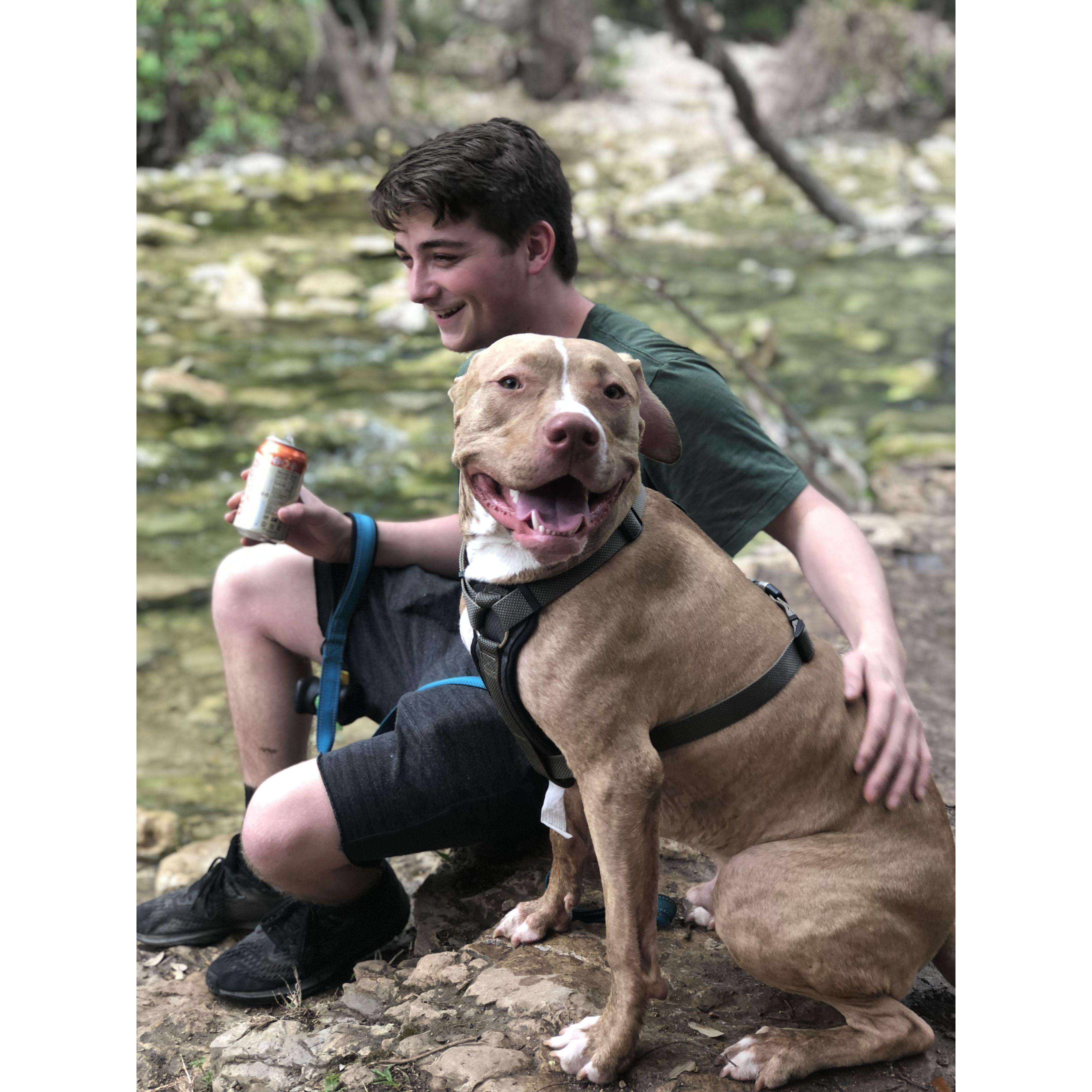 Kane enjoying a nice sparkling soda while on a hike with our dog Thor. (2019)