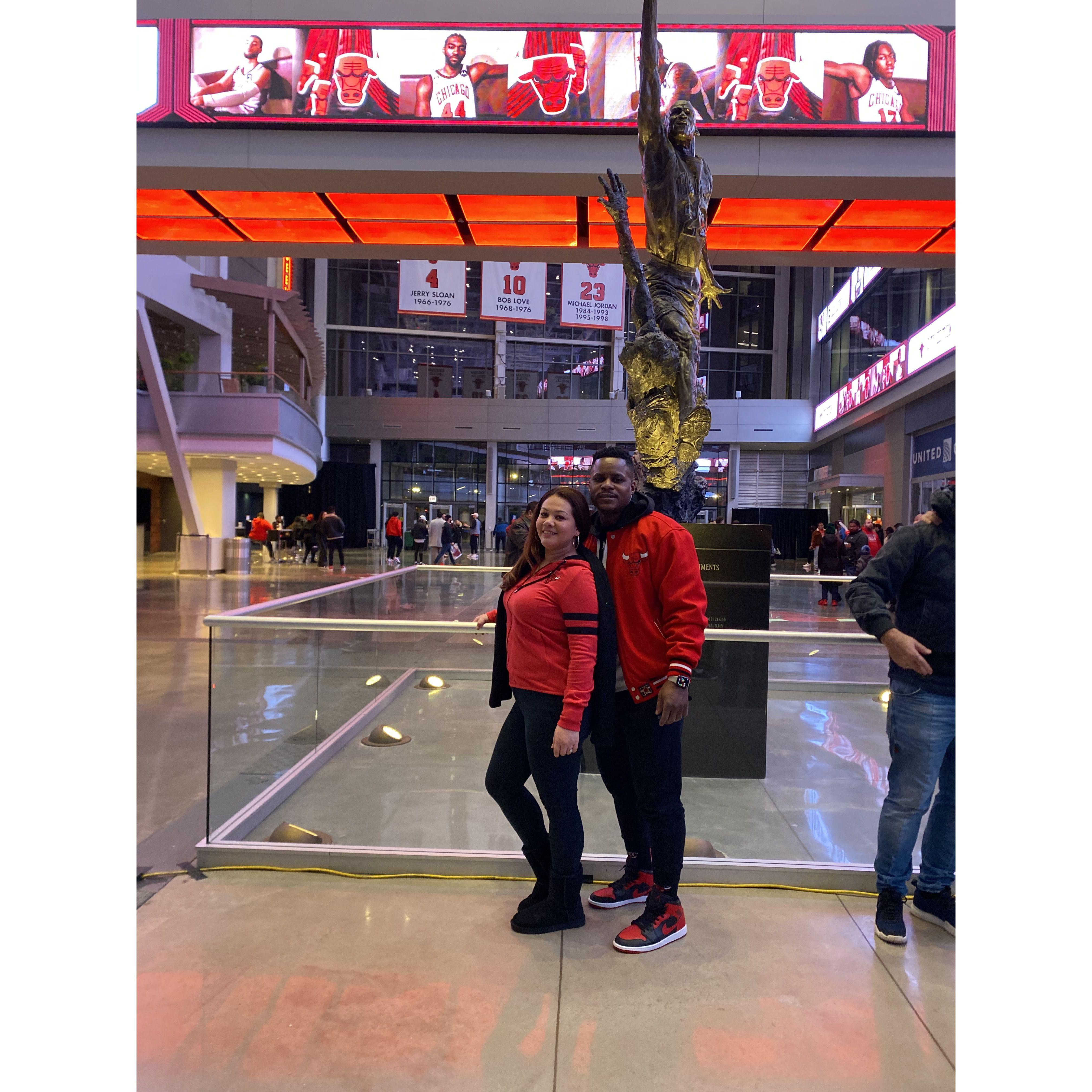 Chicago Bulls game. You see the GOAT statue!