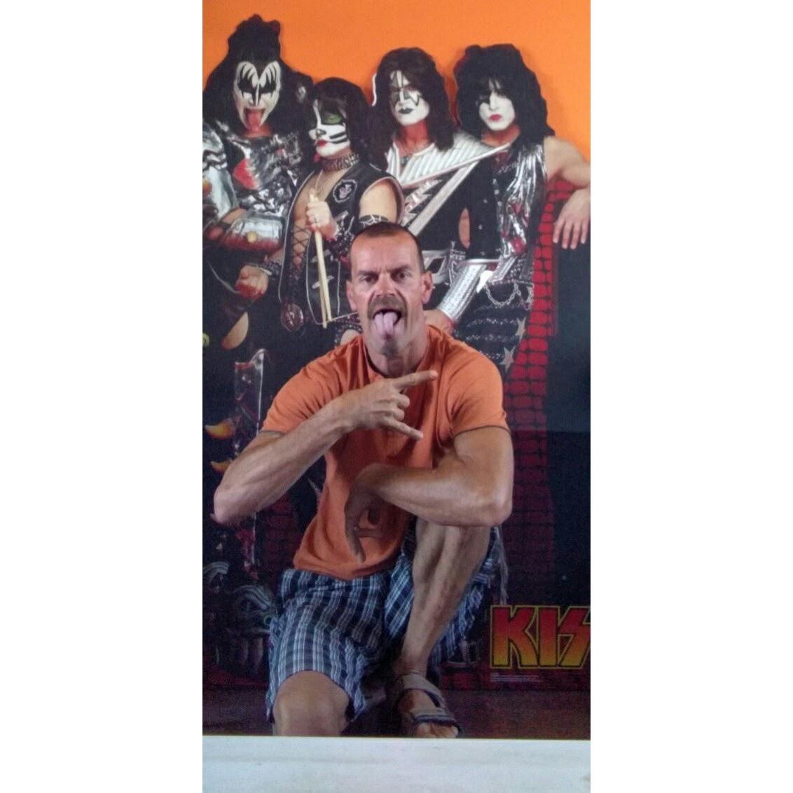 My KISS Freak! David posing with his surprise birthday guests one year.