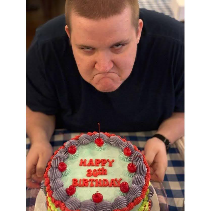 Bob showing off Liz's 13 going on 30 themed cake