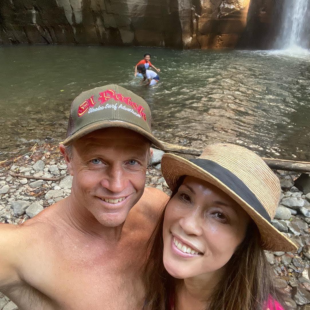 All of us jumped in at a waterfall in El Salvador — laughing, splashing, and making memories together.