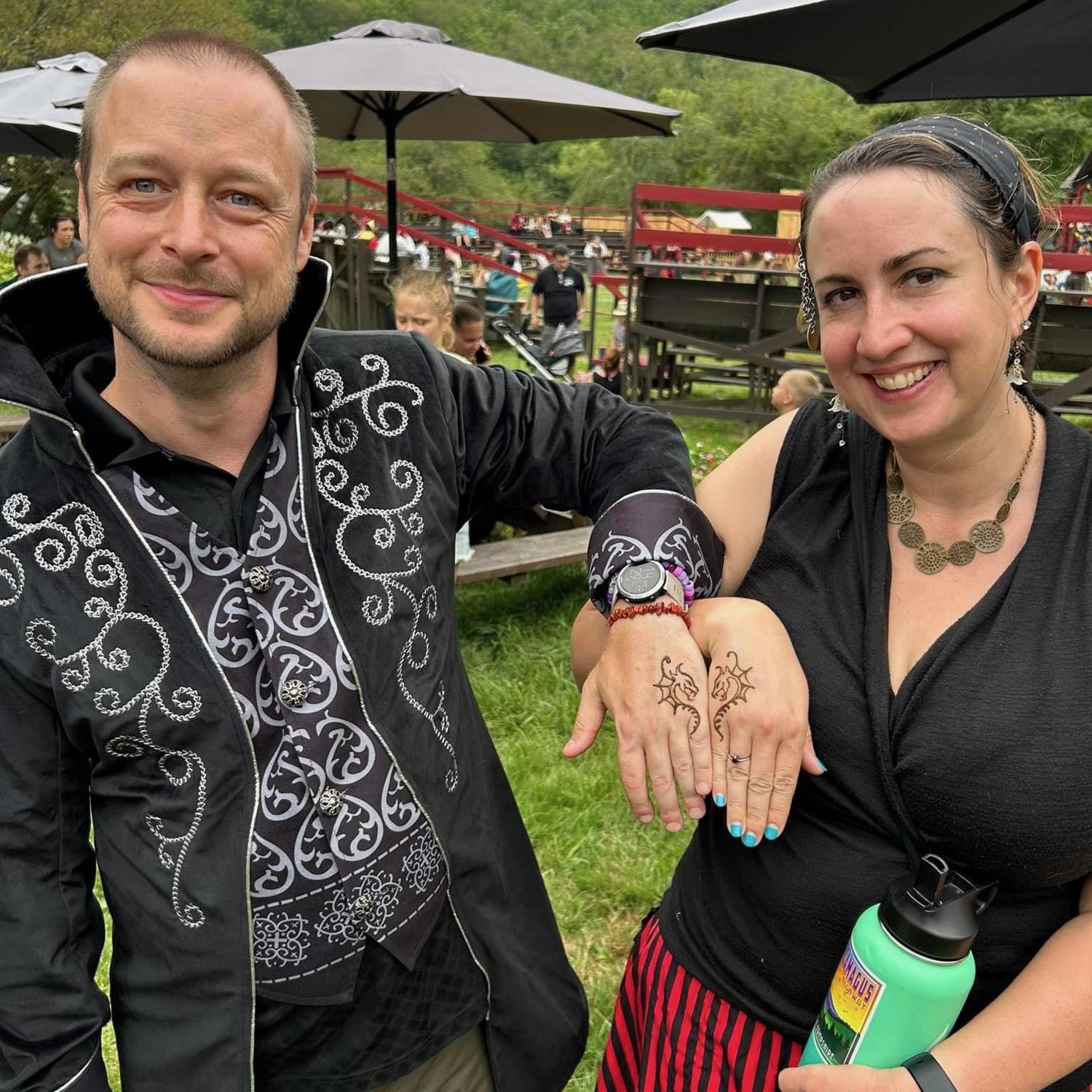 Having fun at a ren faire with our dorky matching dragon tattoos that vaguely make a heart.