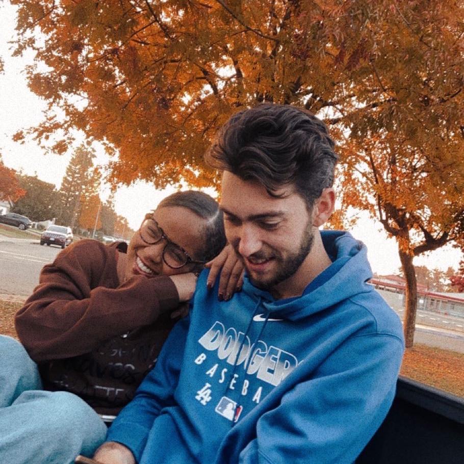 Sitting in the back of the truck at a park