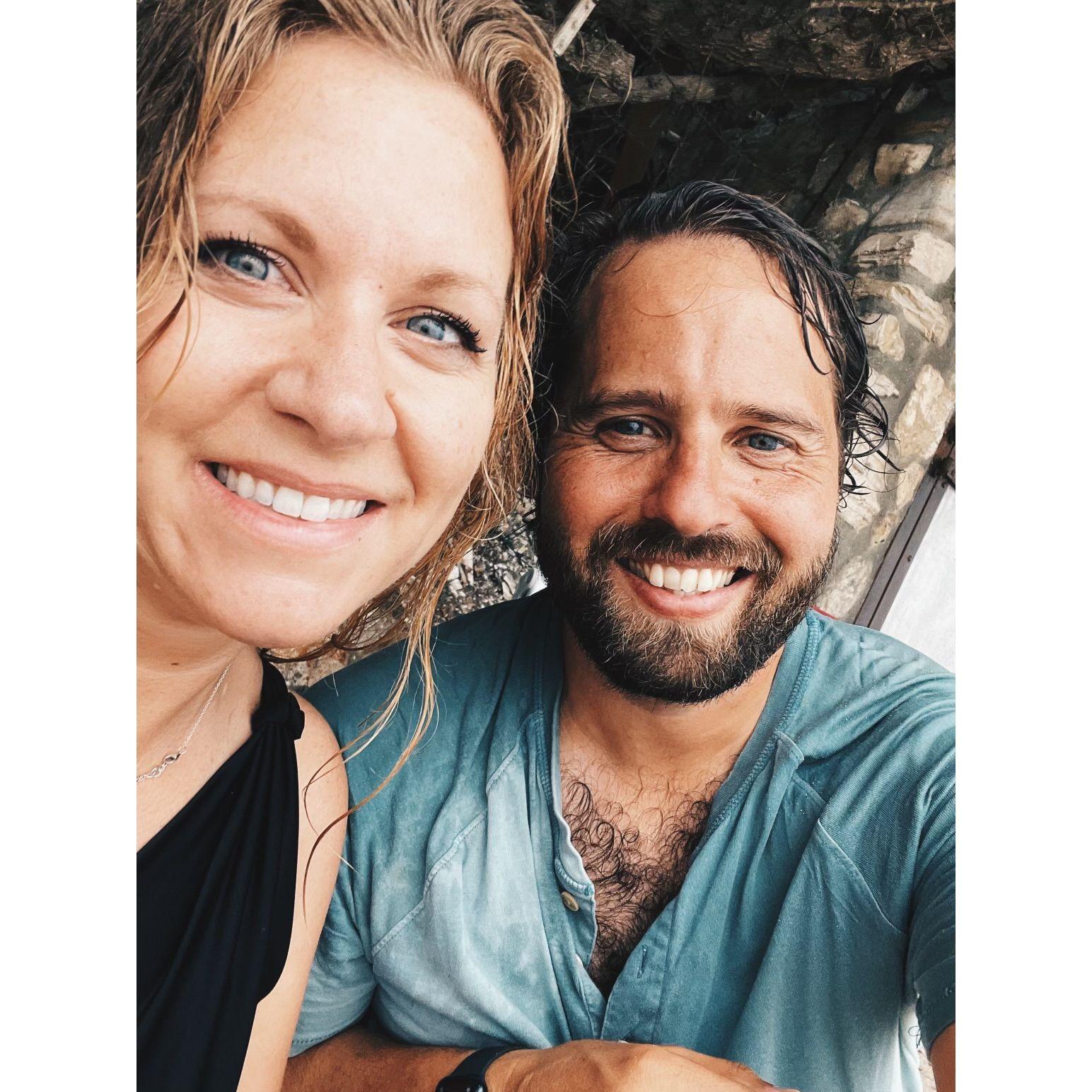 Seeking refuge from the rain in an alcove on the beach.
