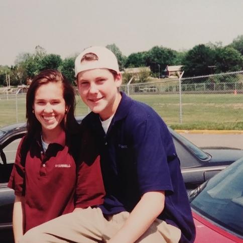 The Bishop O'Connel High School parking lot. She's a Senior (got to wear the maroon shirt) while he is a Junior.  : )-  1994