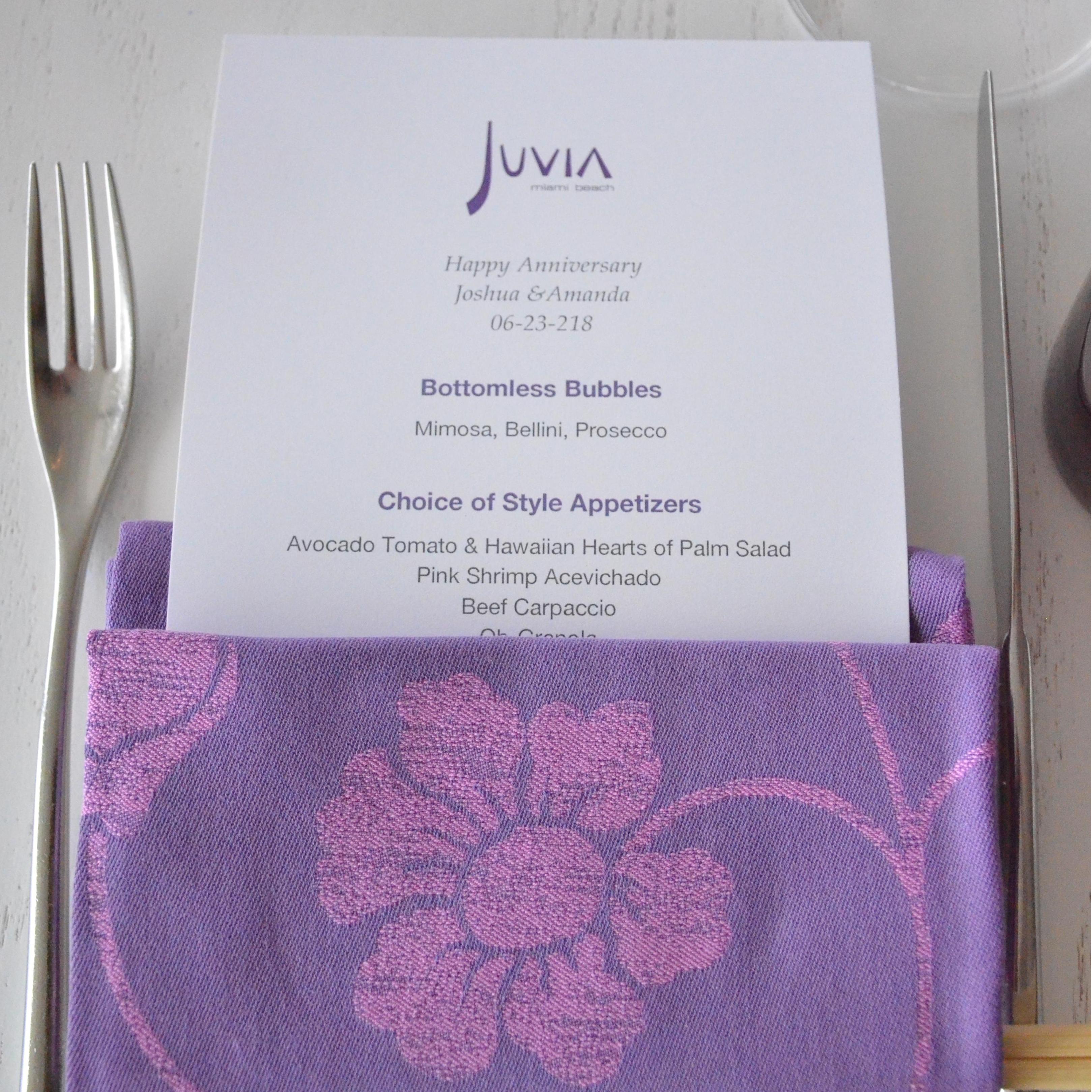 The custom menu congratulating the soon to be bride and groom on their four year anniversary