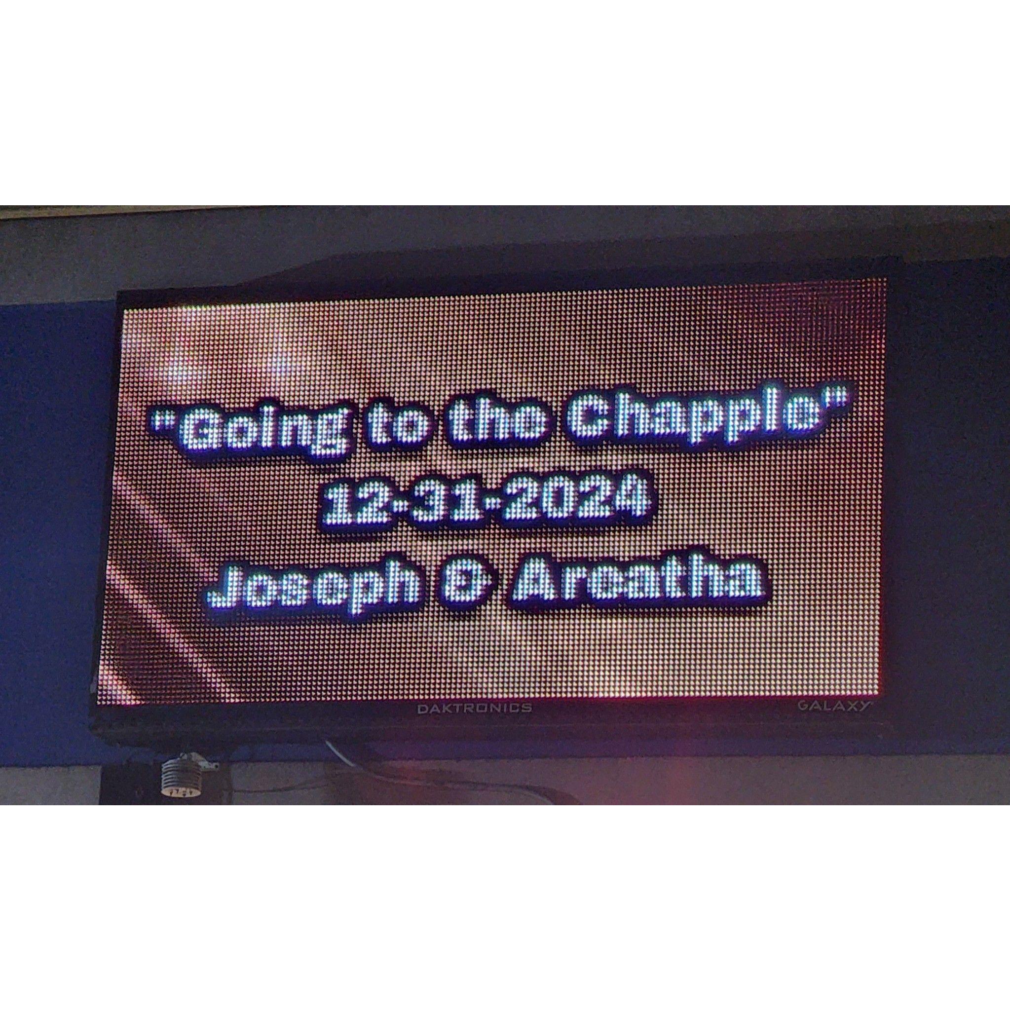 The marquee for the Parking Garage lit up in celebration of the Chapple nuptials