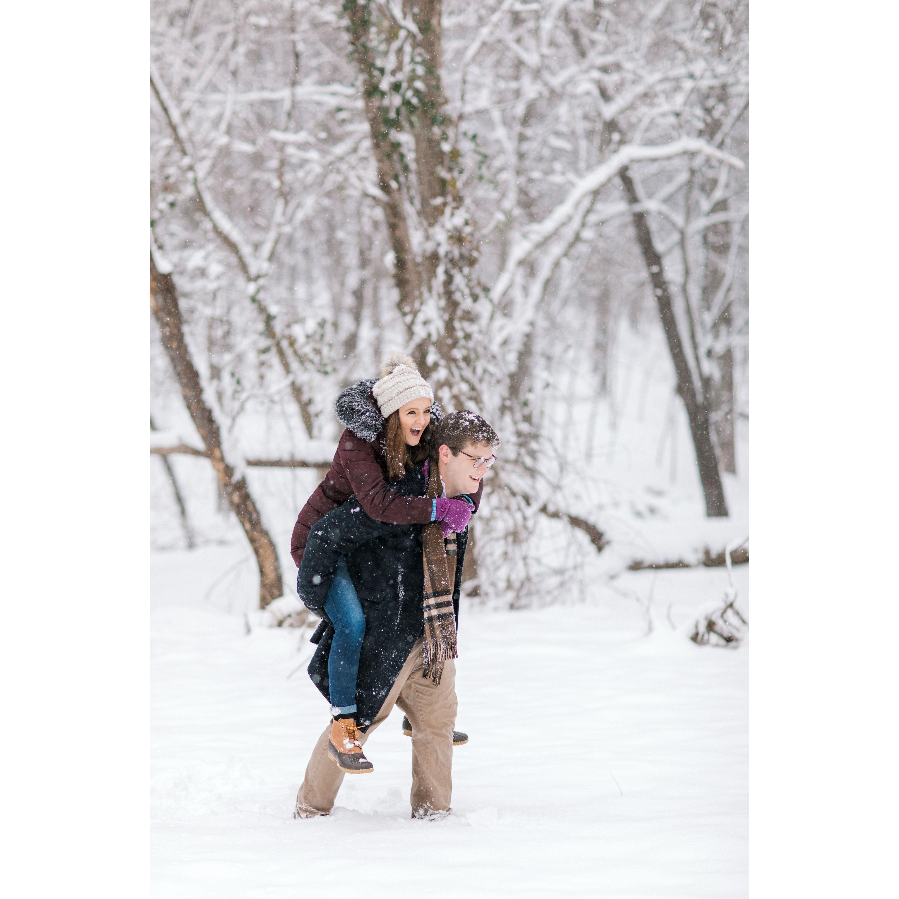 Our photographer, Nikki Schell, got some amazing engagement photos of us on a snowy day in the woods.