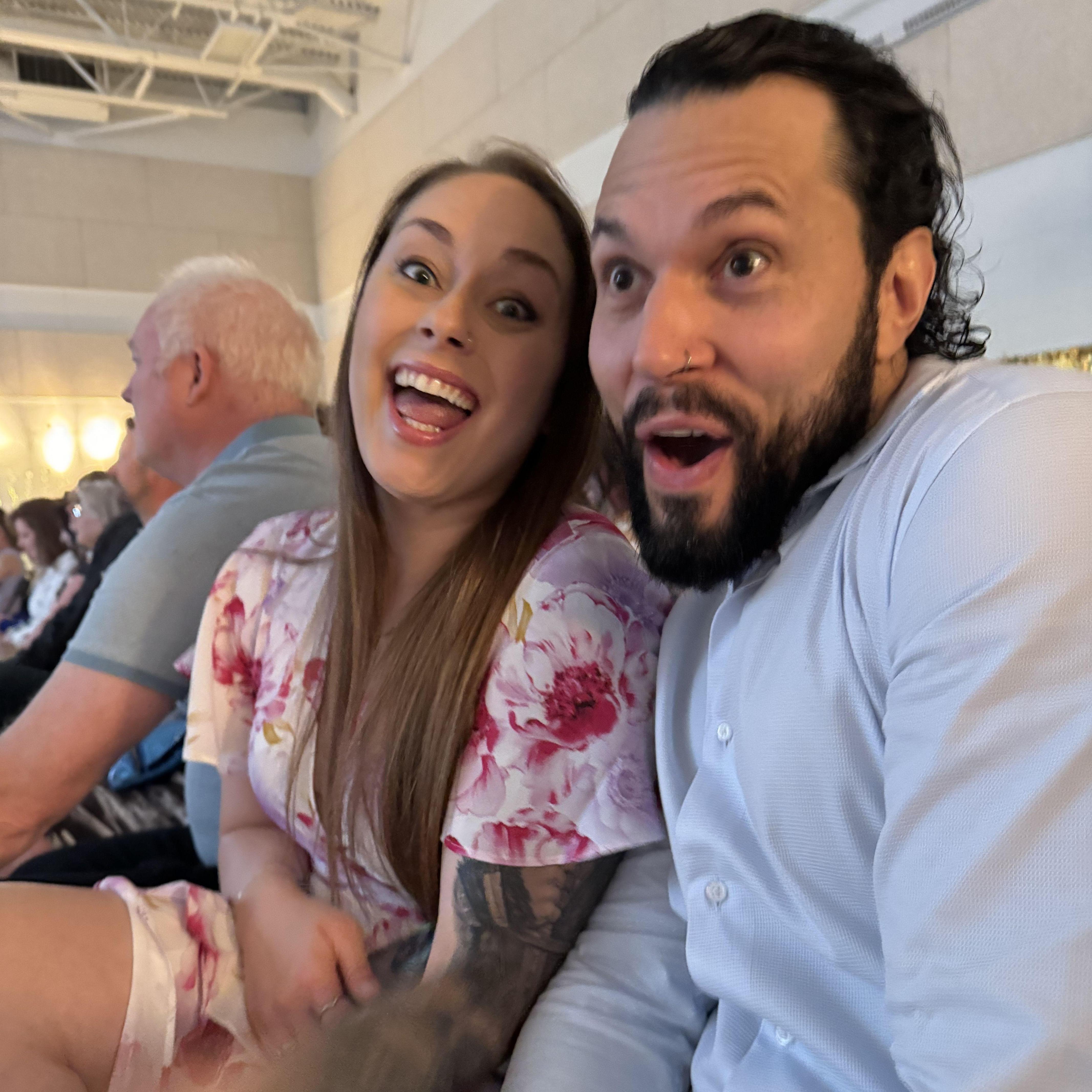 Excitedly watching our daughter graduate grade 9!