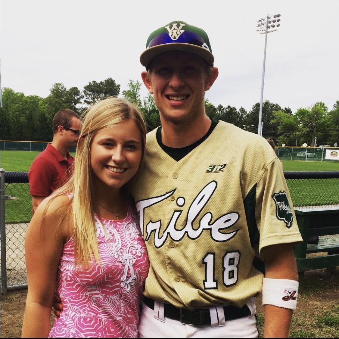 After growing a friendship for months, we decided to give love a chance. This is our first photo together as a couple, and yes, of course it's at a baseball game.