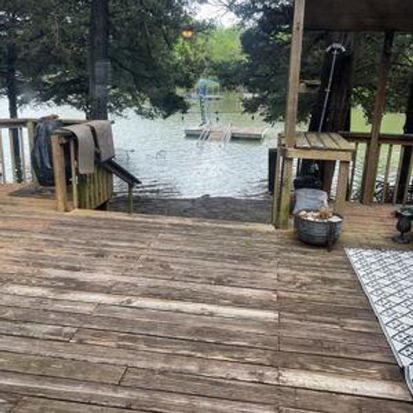 Fix and restain the deck at the lake