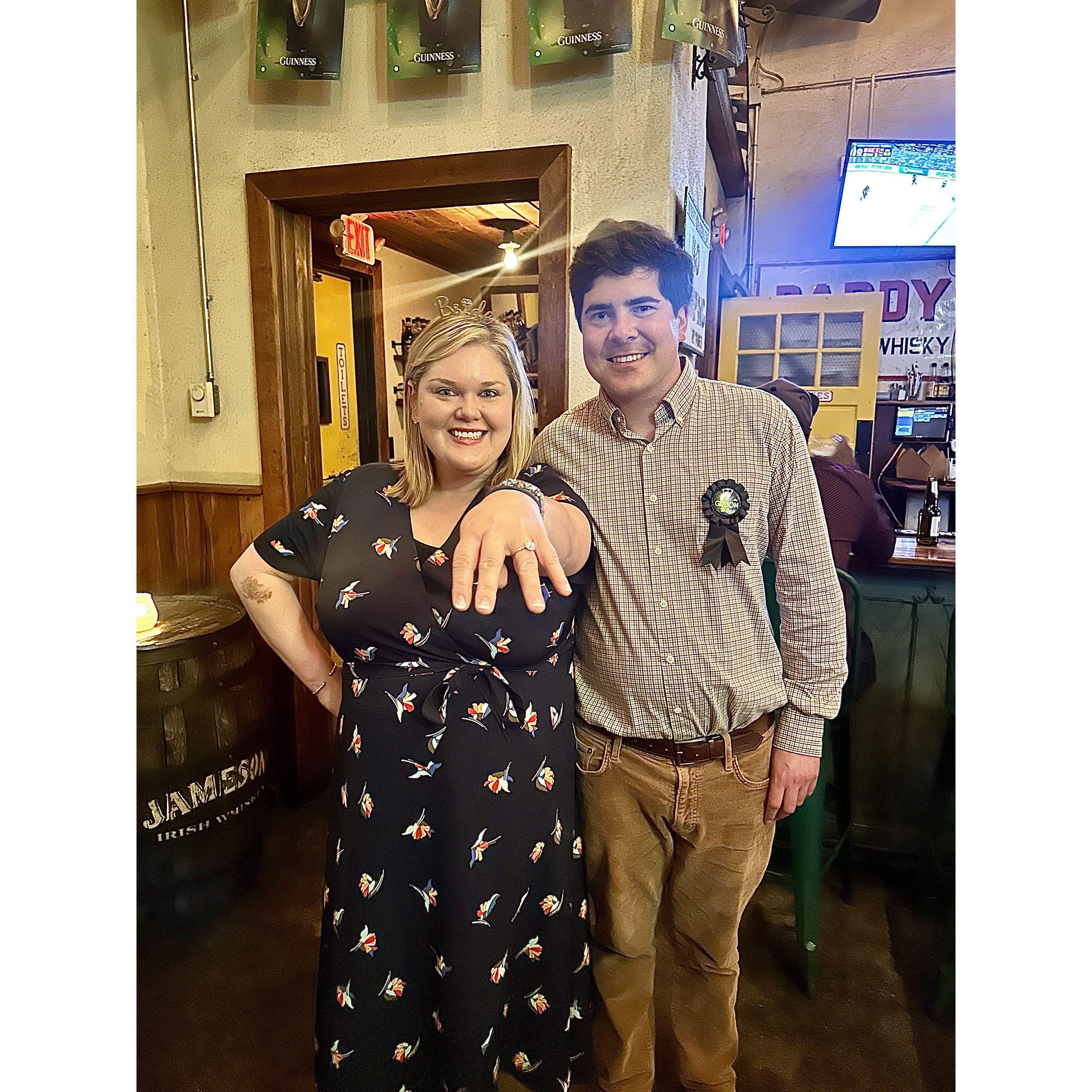 Celebrating the night of our engagement with friends at a surprise party at Workman's Friend
