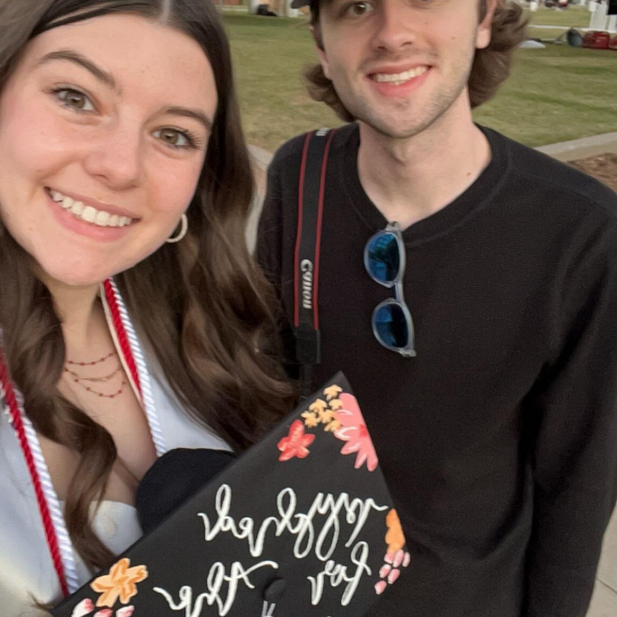 Kannon taking Anne's graduation pics! Favorite camera man!
