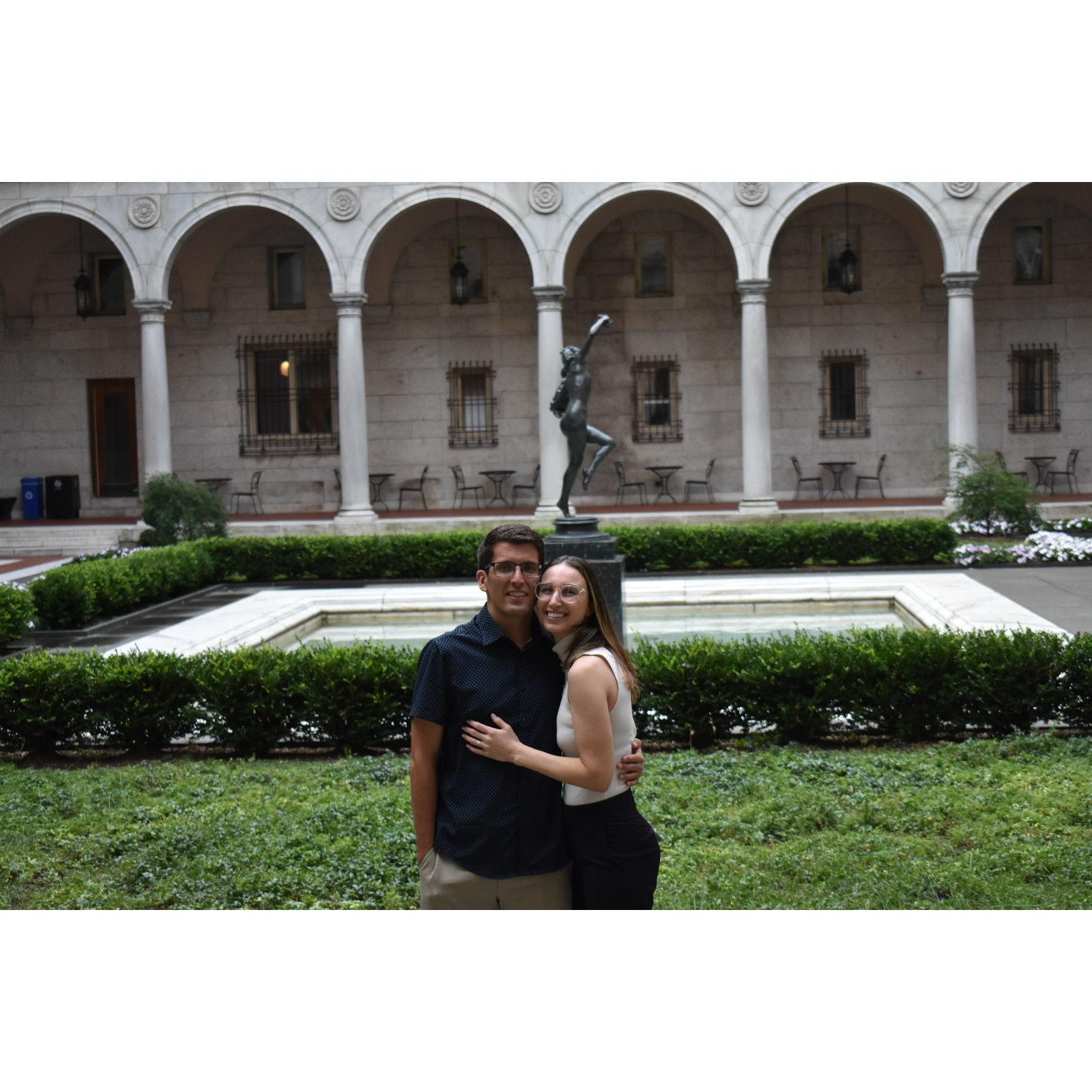 The newly engaged couple posed for pictures in the library's courtyard.