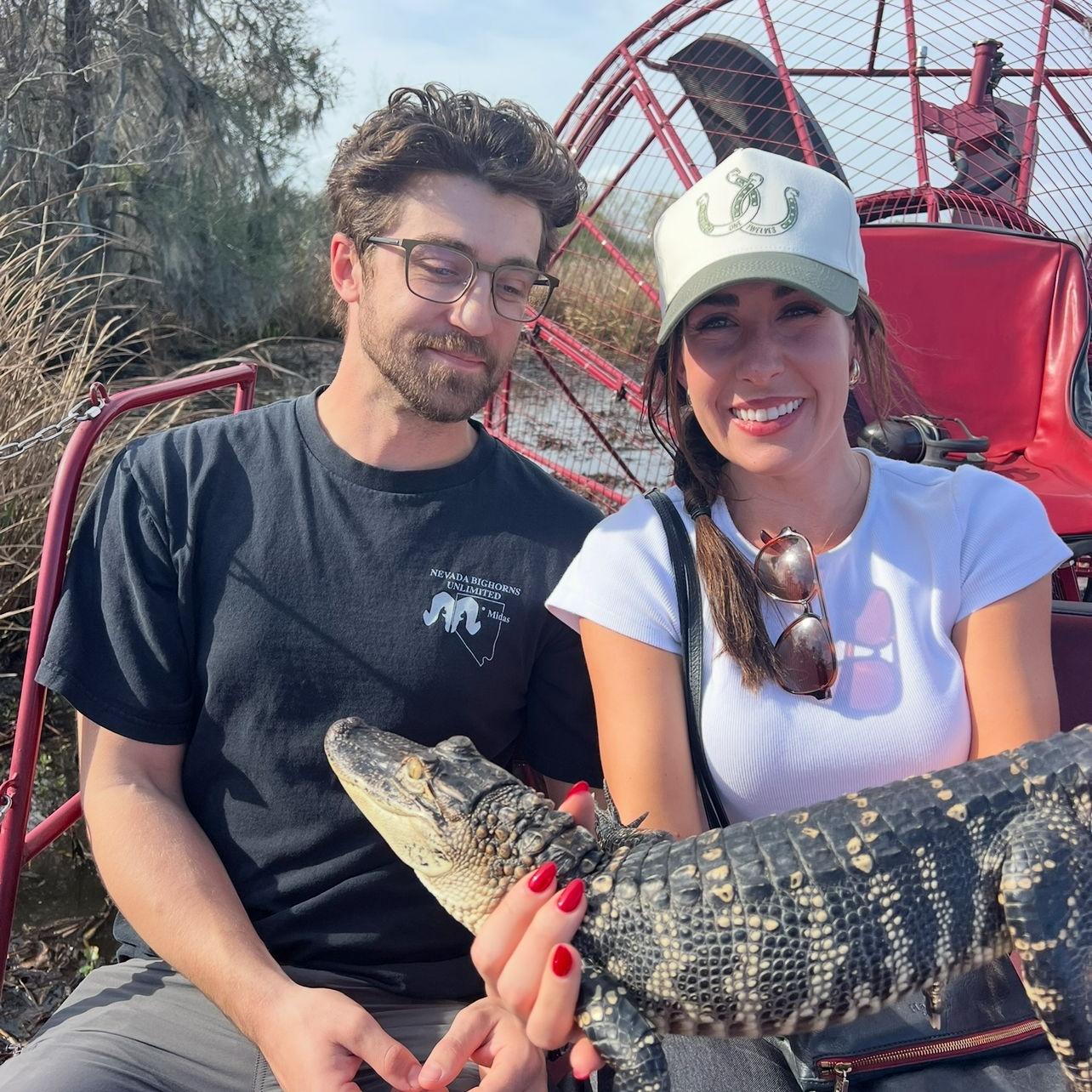 Holding a baby alligator on a swamp tour in New Orleans, LA. February 2025 Katy showed Gage around New Orleans & gave him a tour of Tulane.