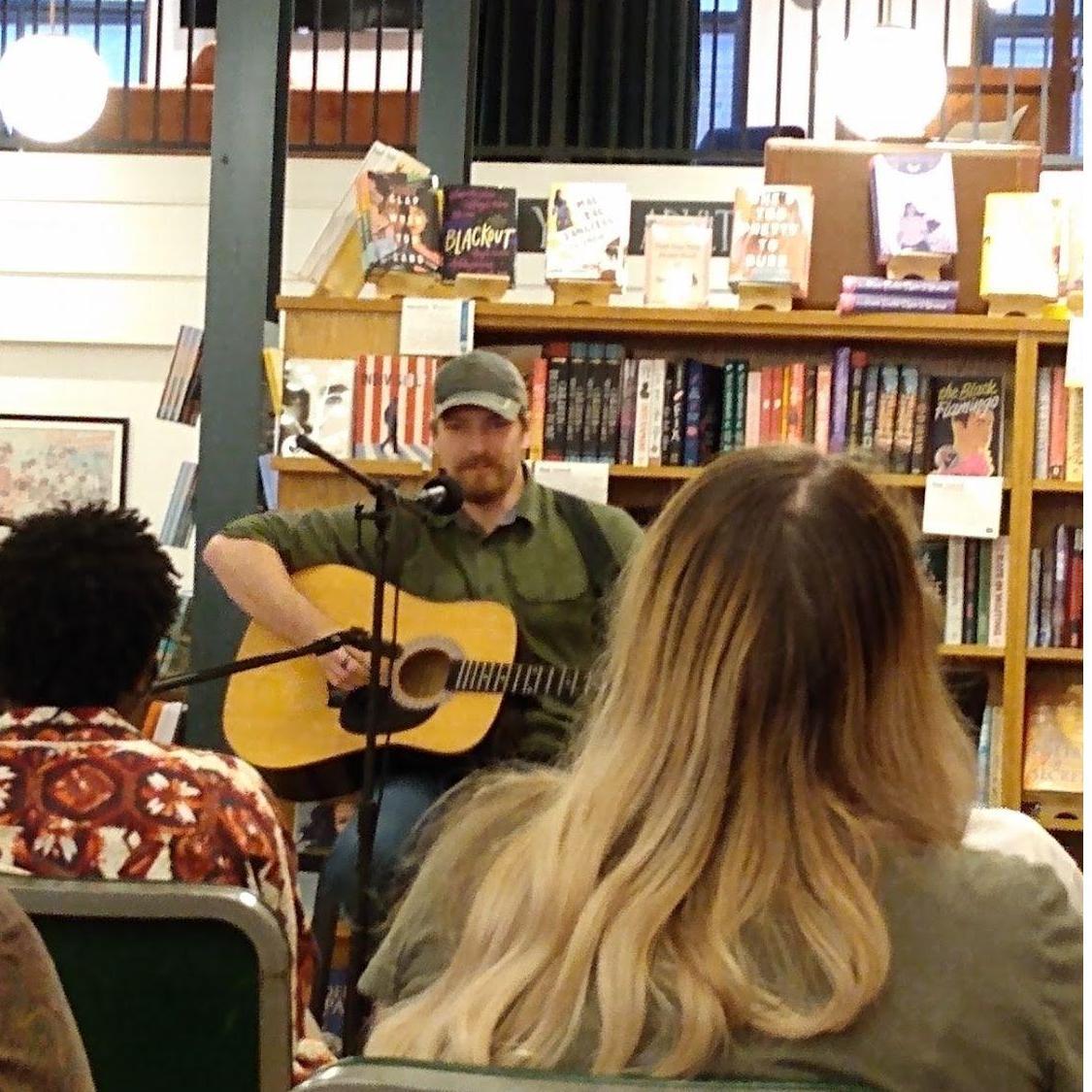 Devon singing at an open mic night