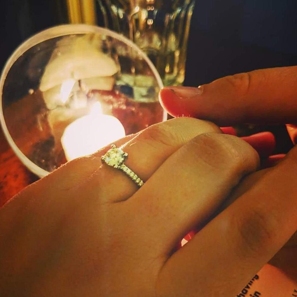 Celebrating the engagement by candelight. Mendocino, CA in December 2018.