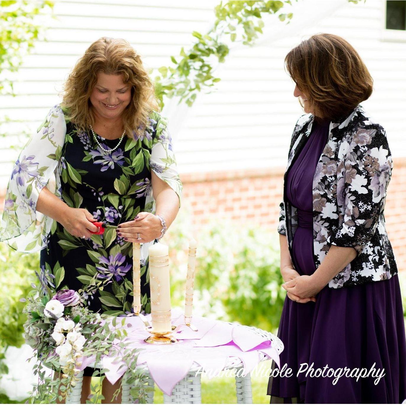 We did a Unity Candle ceremony. Heidi and Mila light candles to represent their side of the family. Stan and I use those candles to light the center candle to represent the union of our families.
