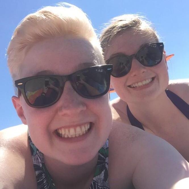 Here we are one of the few times we braved the beach. It was fun, but Jen went home with a whole body sunburn! Oops!
