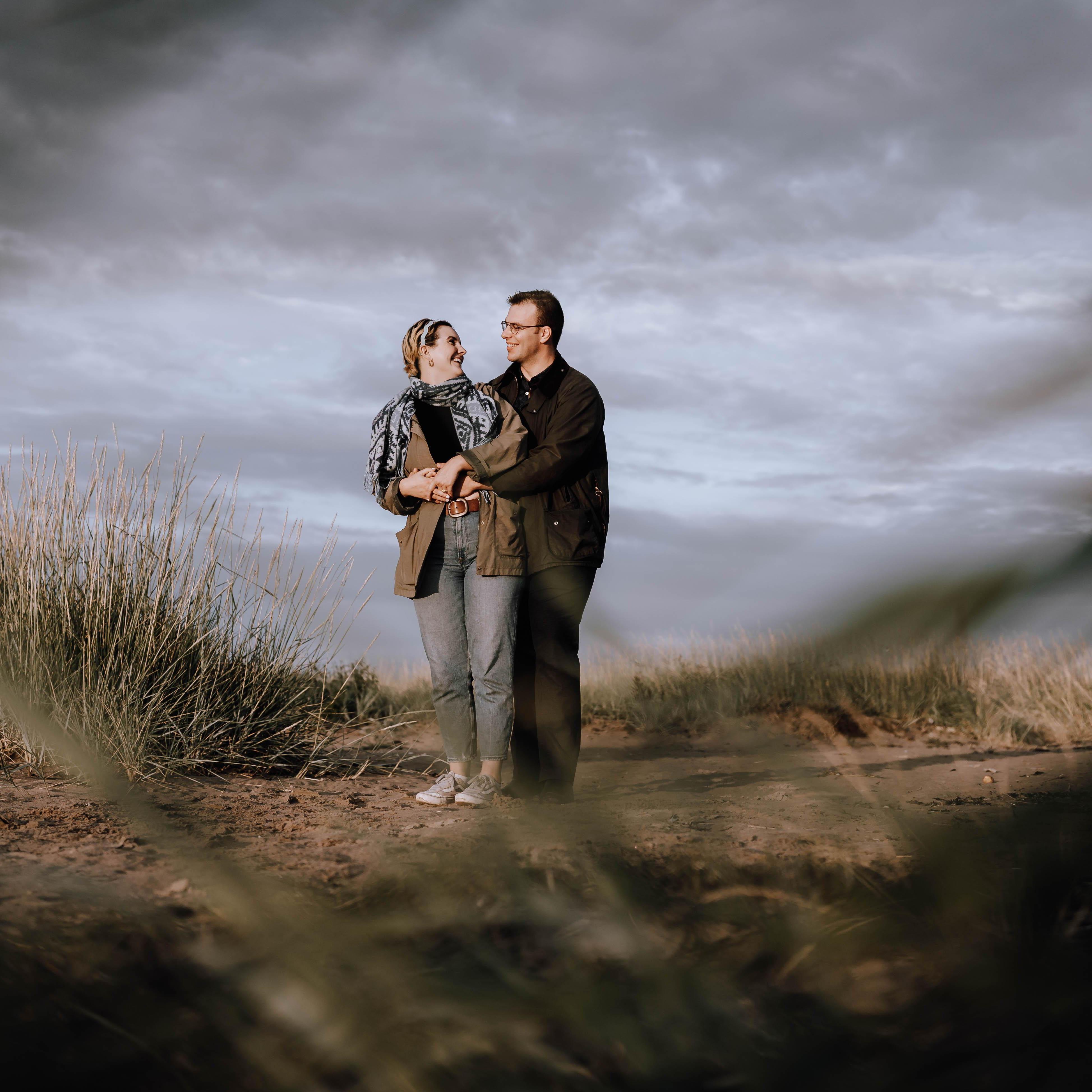 POV: You are hiding in the bushes watching us stand very naturally at West Sands. This is how we like to hold hands. Pointer finger securely fastened around three fingers.