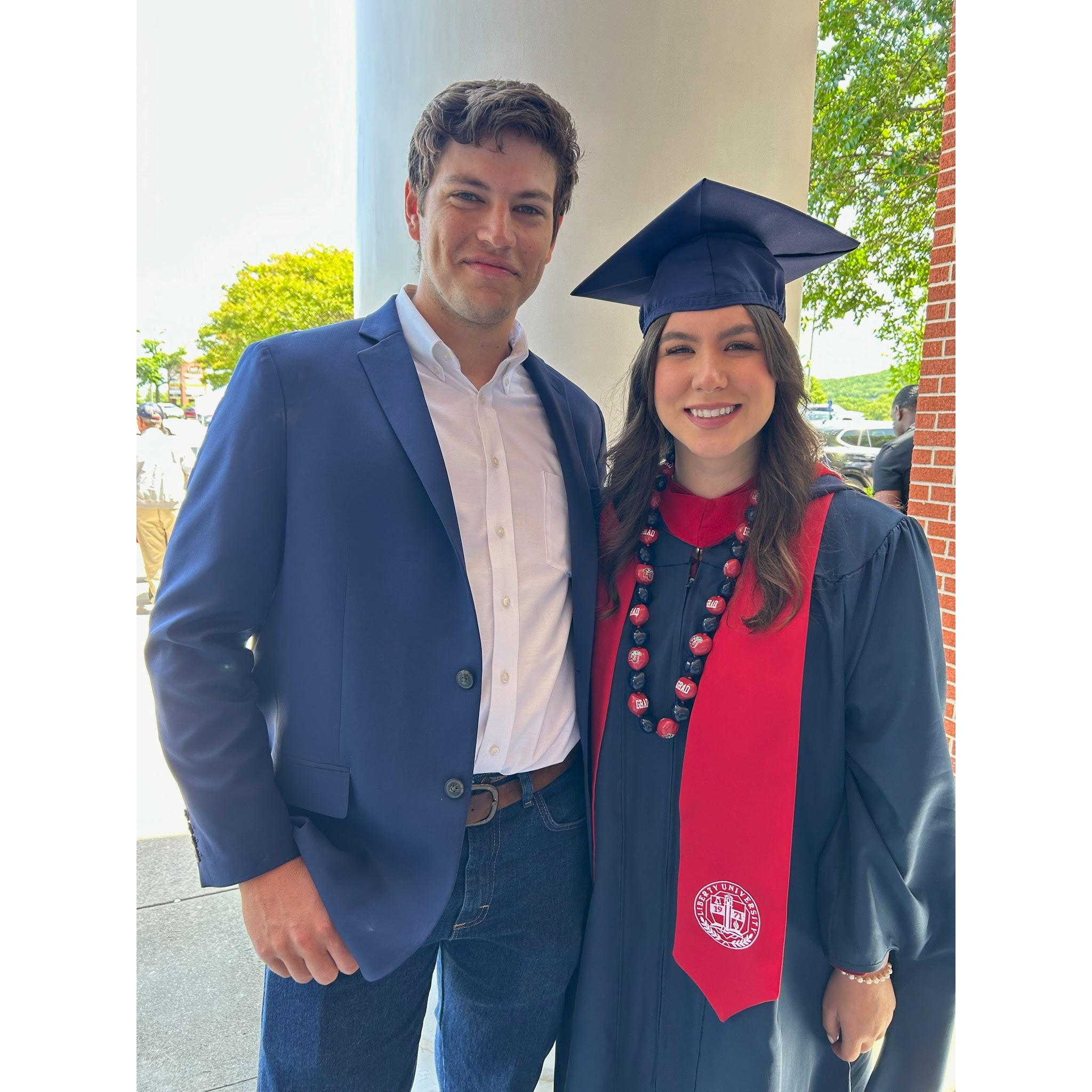 Everett supporting Delanee at her Master's graduation ceremony.