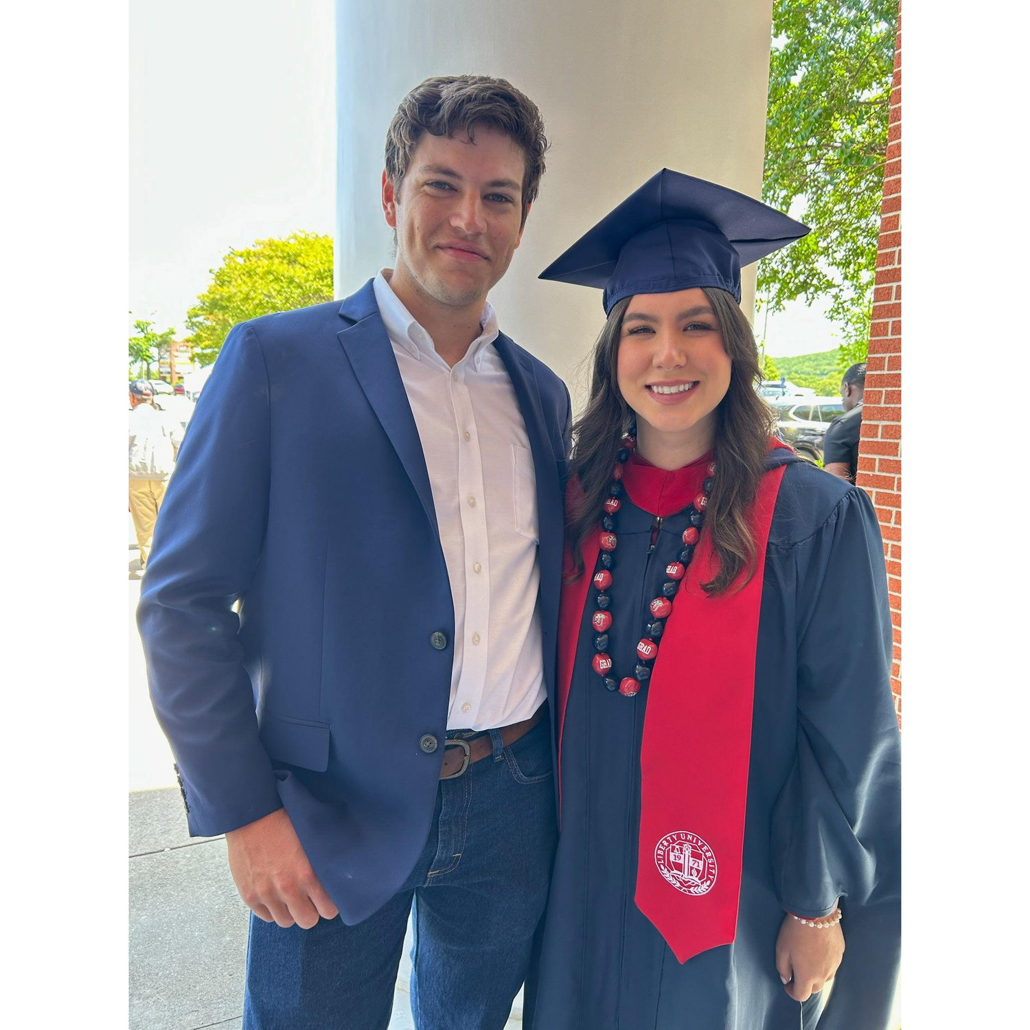 Everett supporting Delanee at her Master's graduation ceremony.