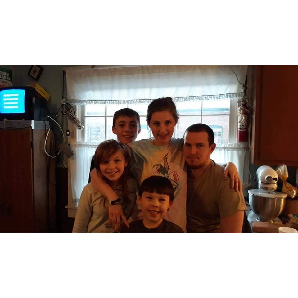 A photo of my siblings and cousin with Daniel and I before I moved