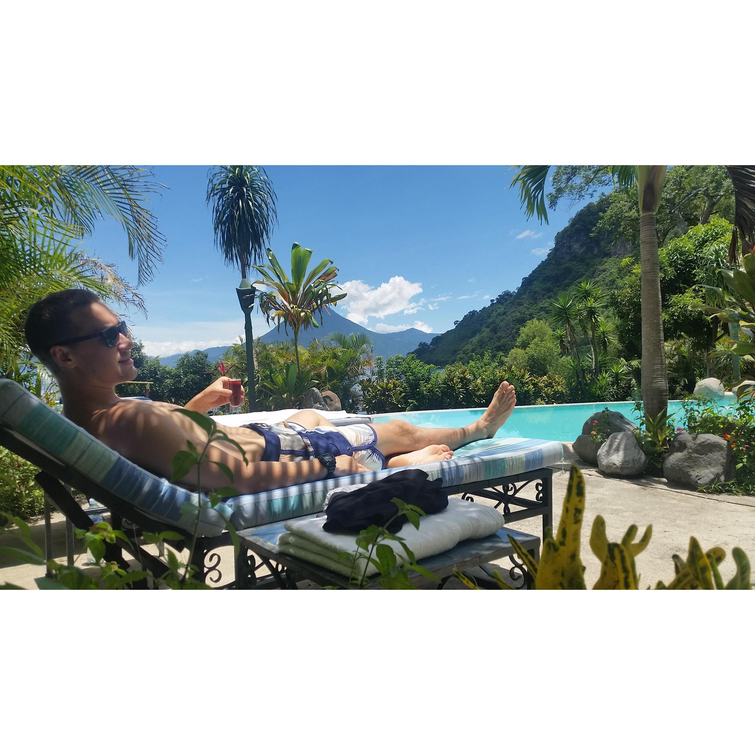 Max enjoying some Zacapa rum by the pool after riding jet ski's during our stay at Lake Atitlan in Guatemala.