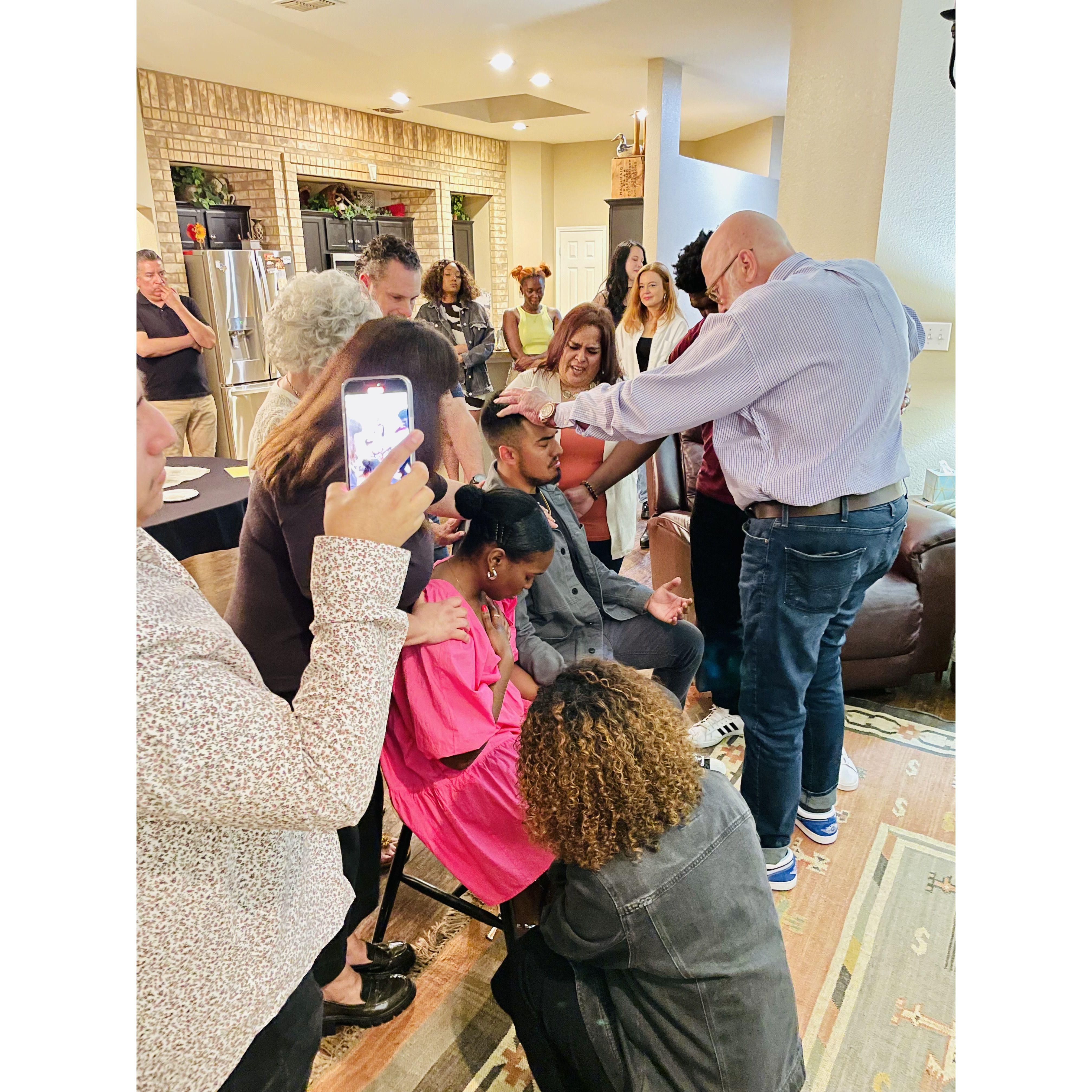 Some of our community praying over us immediately after we got engaged.