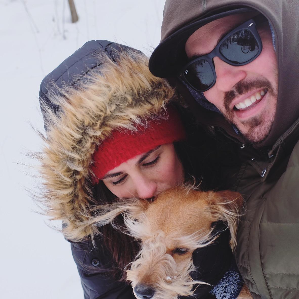 Family hug in a snowstorm