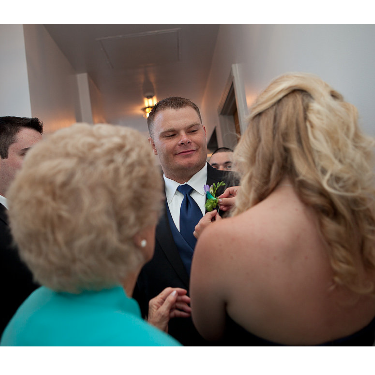 Checking her out or wondering whether JoJo will stick him with the buttonier pin?