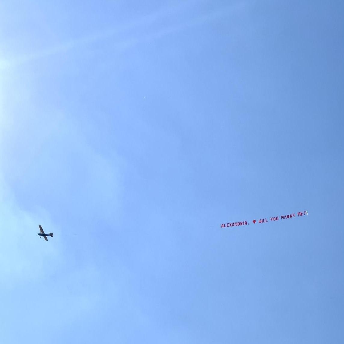 Look up! The sign says, Alexandria Will You Marry Me?