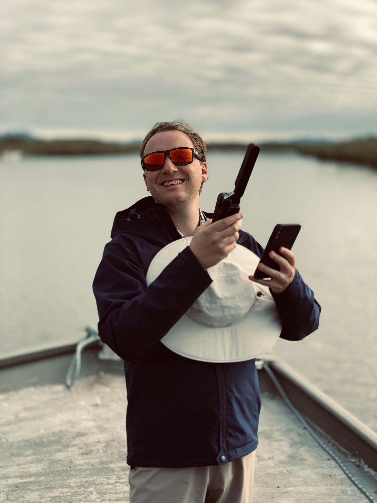 Evan taking his satellite phone to Alaska... so that he can take work calls on vacation.. and Evan finally getting service in the middle of the river.