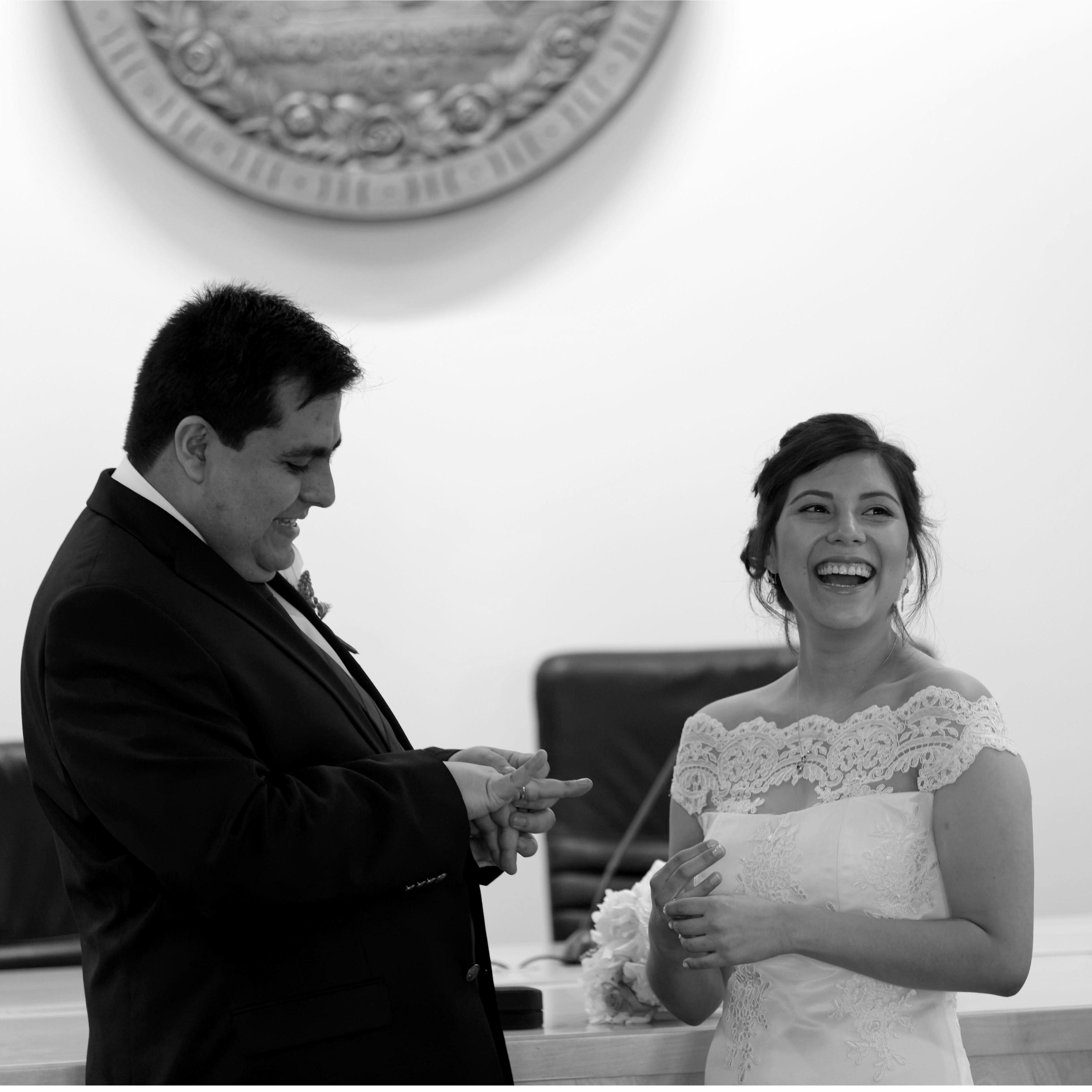 Sharing some laughs at our civil ceremony when the ring wouldn't fit.