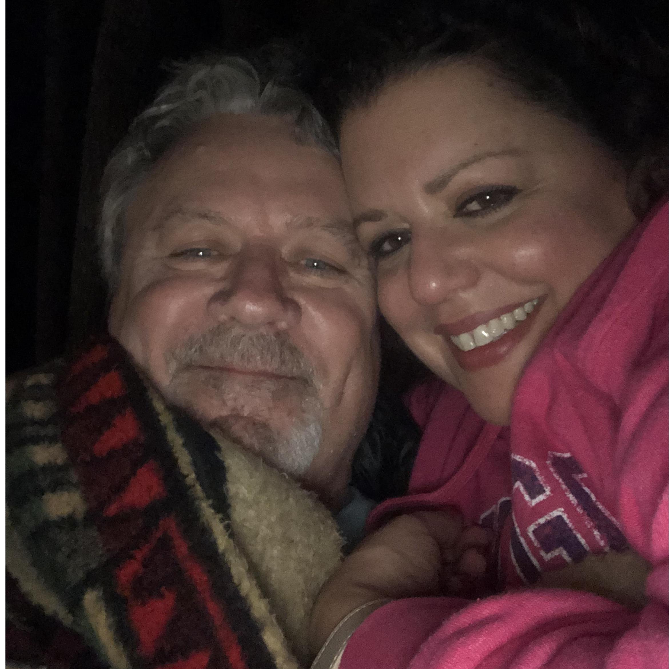 Snuggling by the fire. 12/19 Our first weekend away together