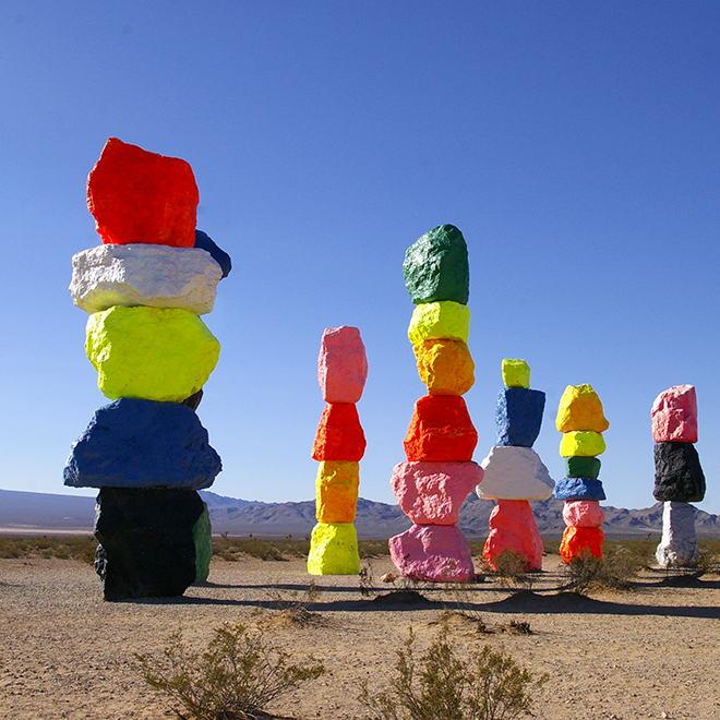 Seven Magic Mountains where the desert meets art!  7 painted boulder totems up to 35 ft. high by stand out in the barren Mojave Desert.  Watch out for skeletons when venturing out there.
