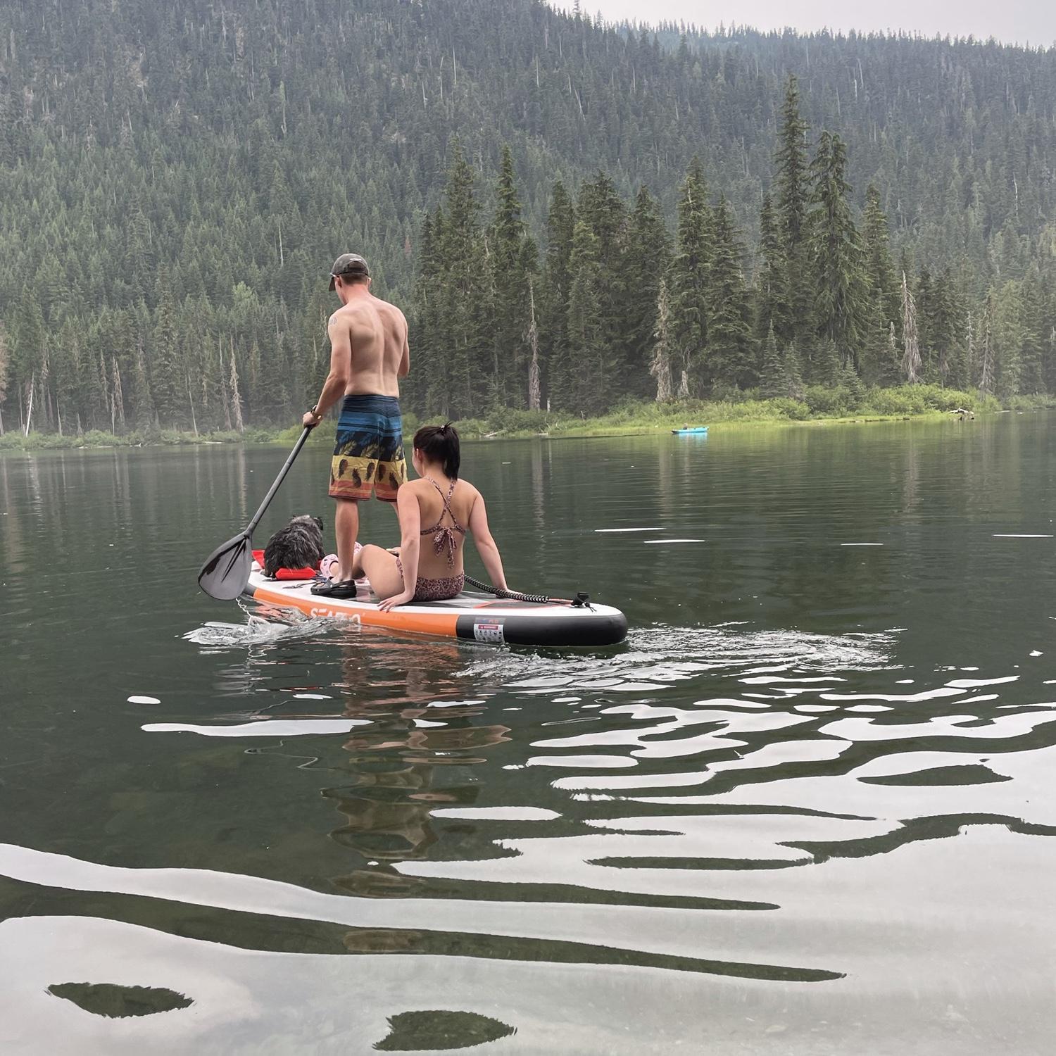 Mark, Maddi, and Suede paddle boarding at Cooper Lake