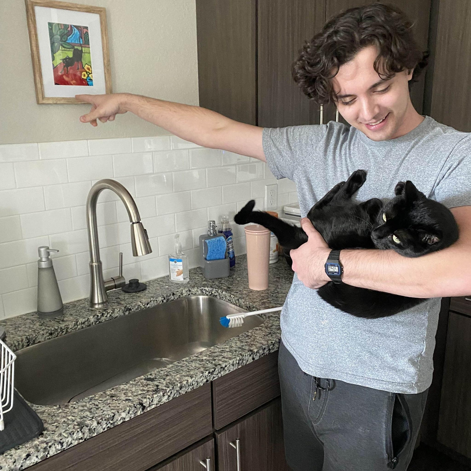 Right after we moved into our new apartment, Joshua showing Little Baby a picture of her above the sink