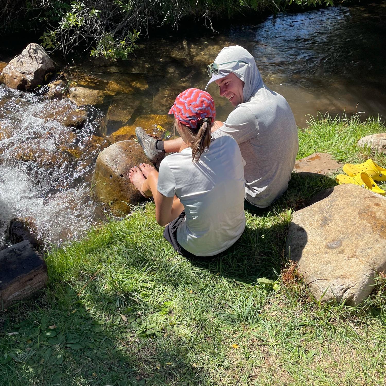 Maya treating sore feet after running 100 miles