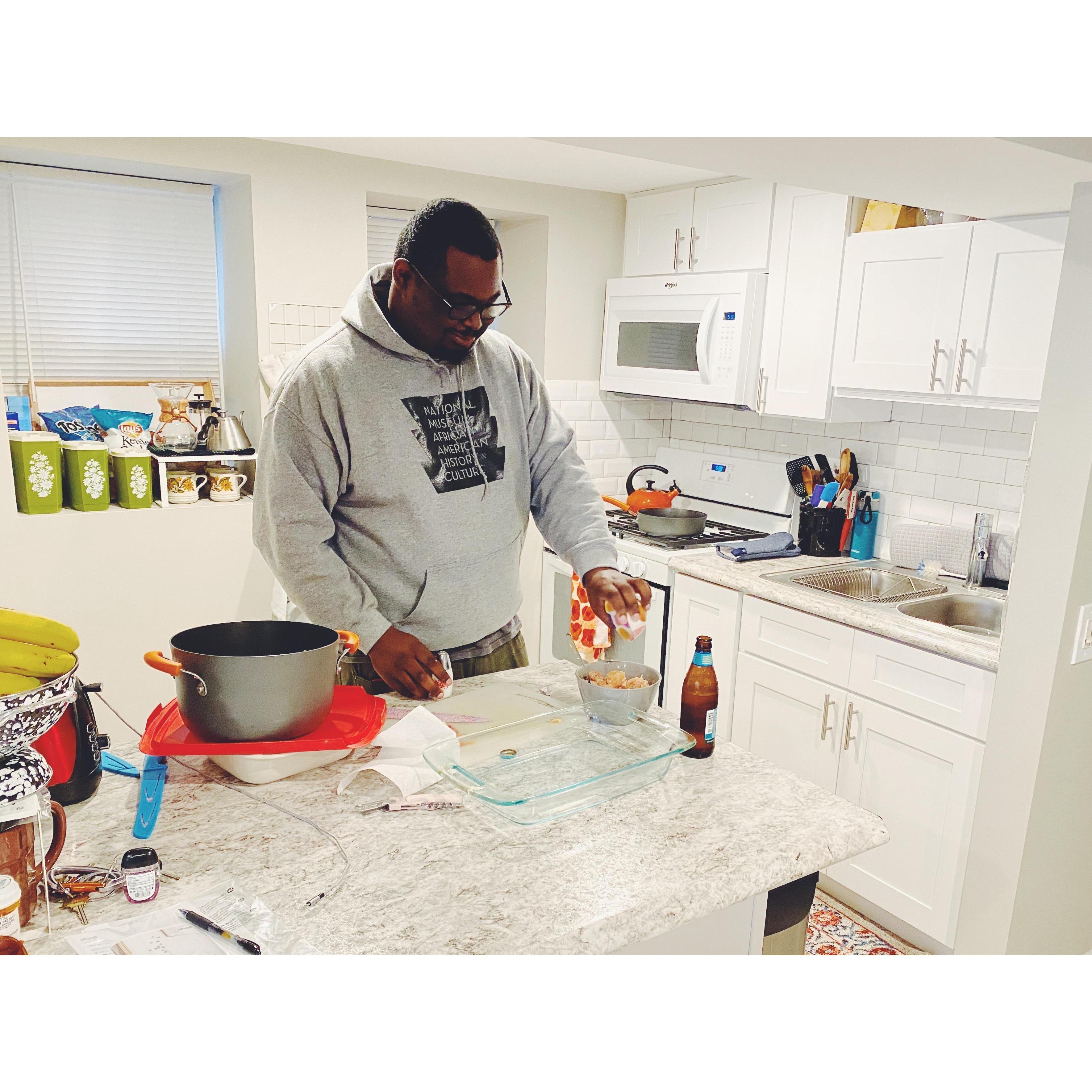 Kris cooking for Katy on one of their first of many early pandemic stay-at-home dates
