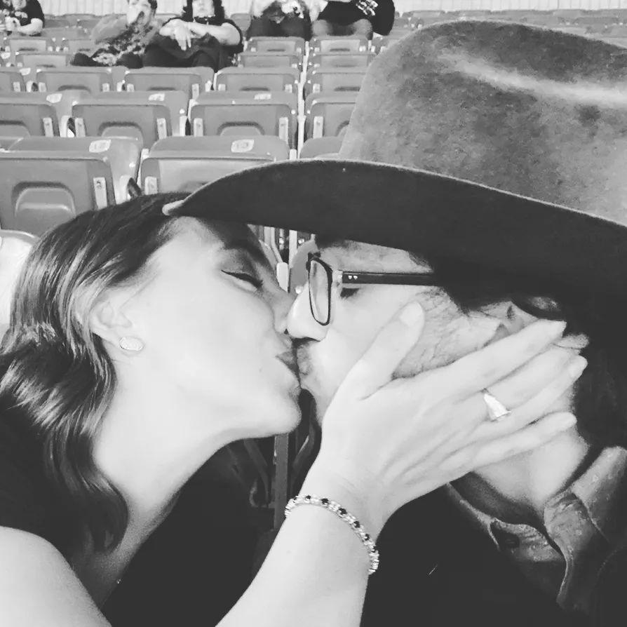 This picture was taken minutes after we got engaged at the Houston Rodeo. The bracelet in the picture is where we pulled the diamonds we used in the halo of the engagement ring. 