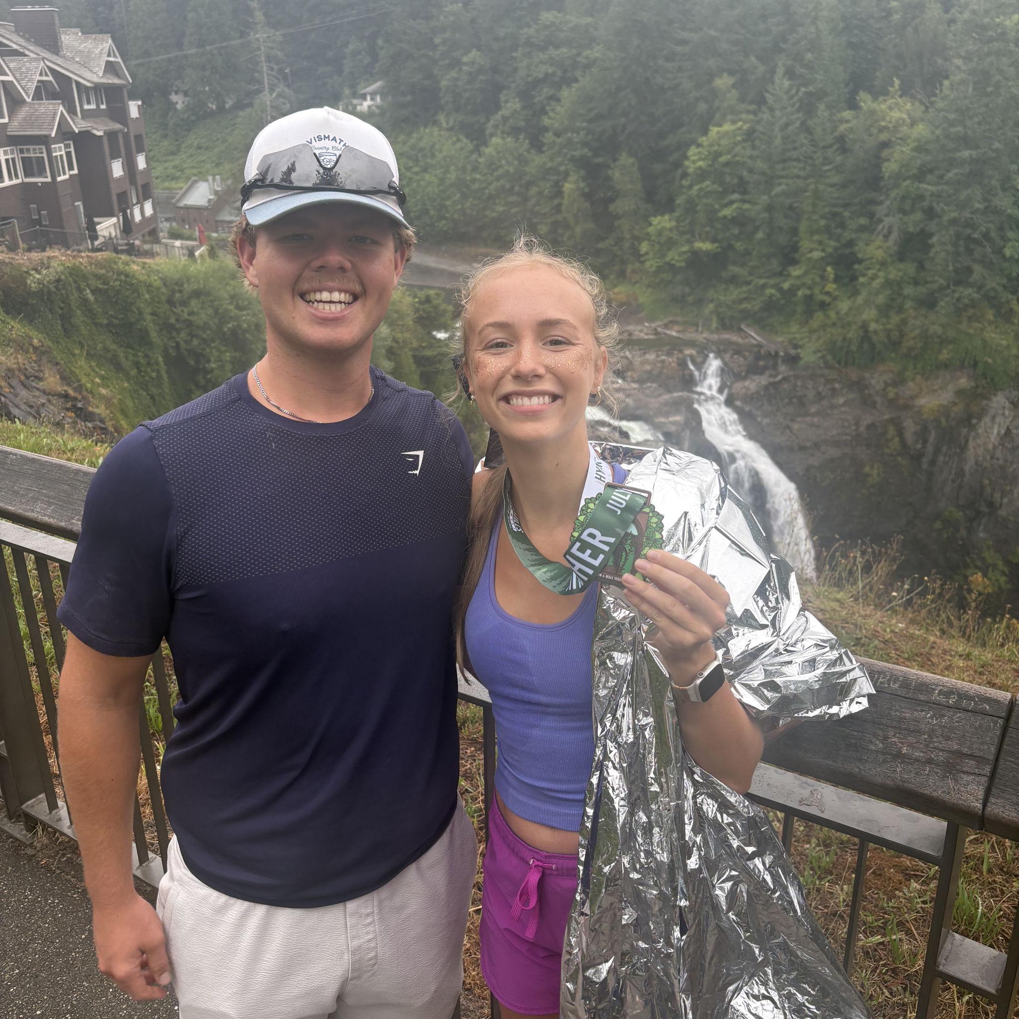 photo at snowqualamie falls right after Stella completed her third marathon.
