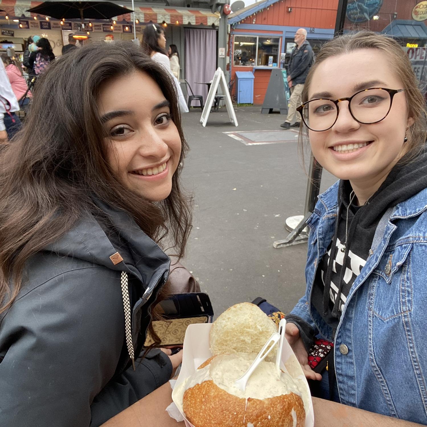 Harlie and Stacy seconds before trying the most delicious clam chowder on earth
