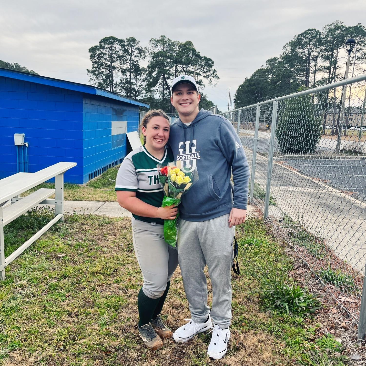 Michael brings Tiana flowers for every softball game he attends.