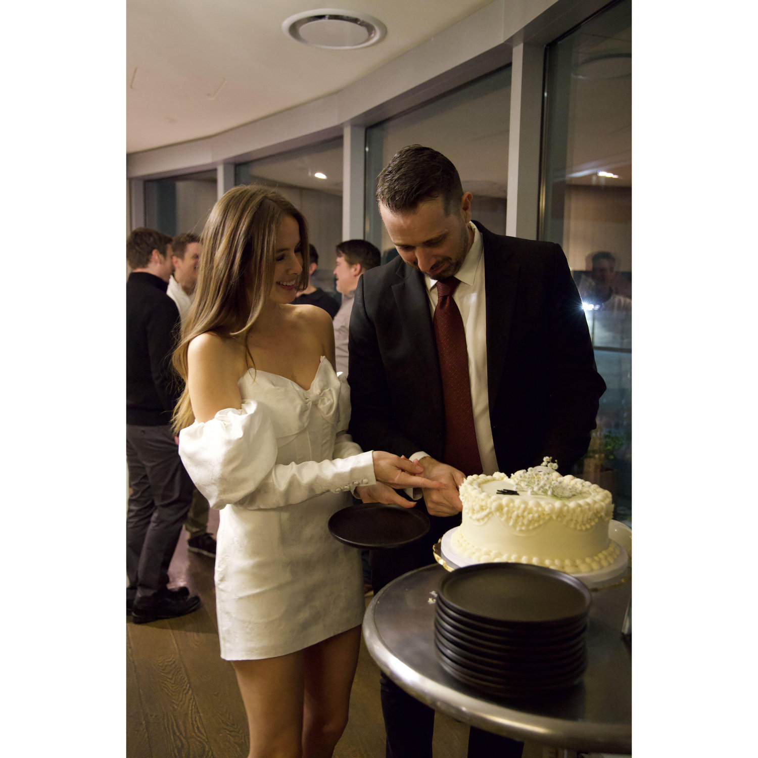Practicing cutting the cake at our San Francisco engagement party.