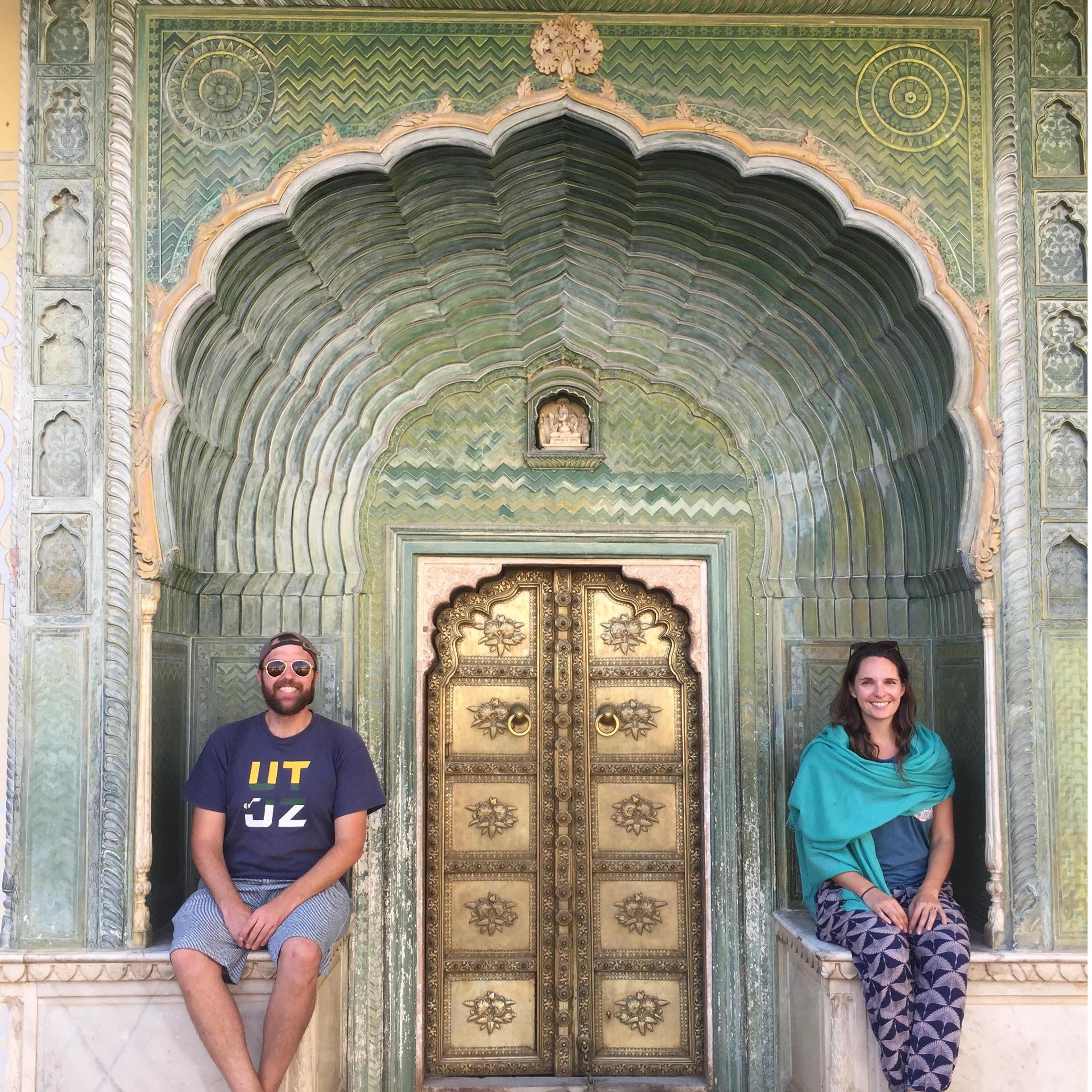 In front of an intricate doorway at the palace in Jaipur, India