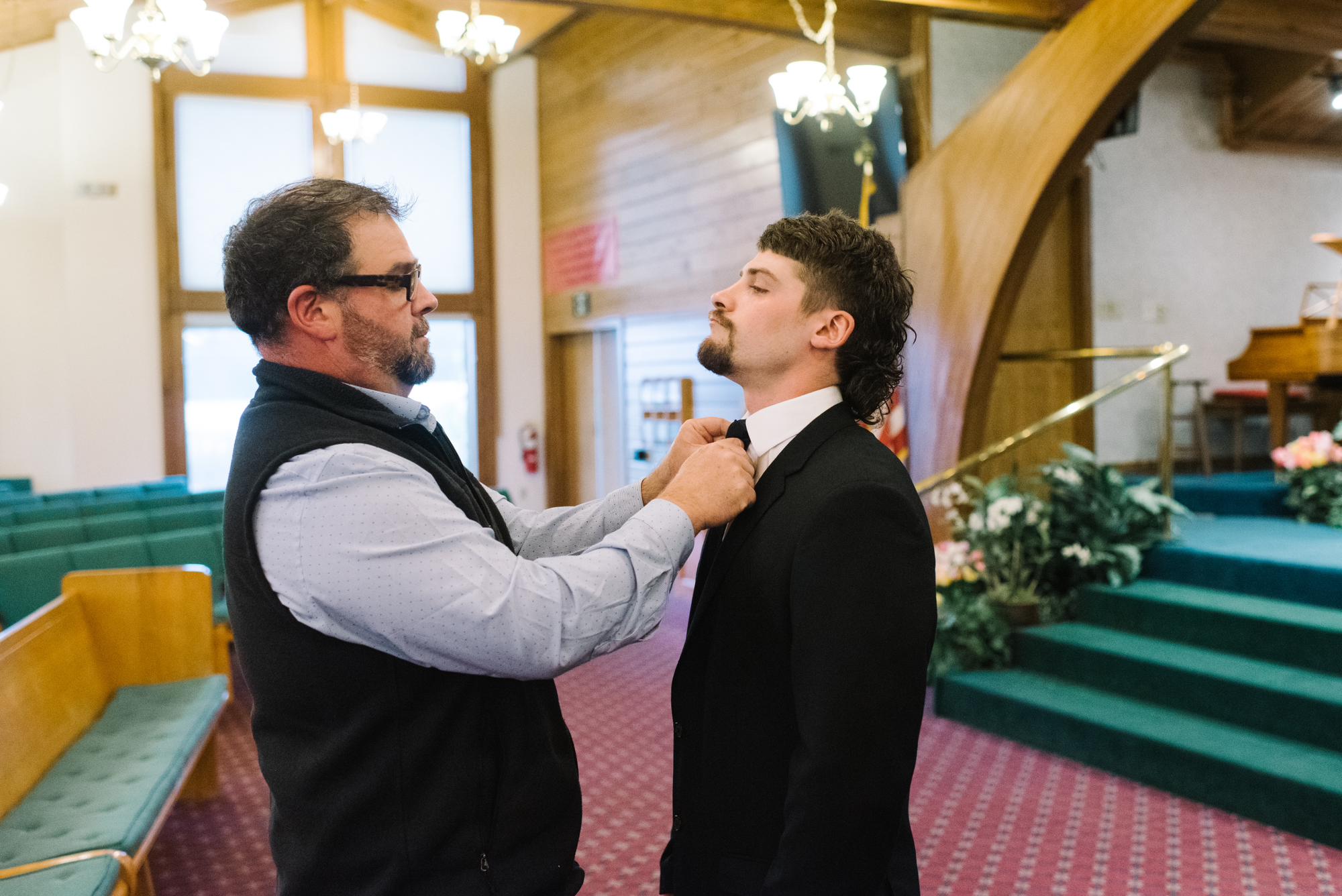 Bops fixing Kaleb’s tie before Jamie walks down the aisle