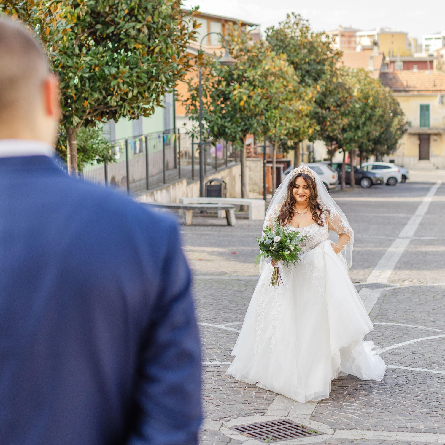 The bride walking up the aisle to her future husband.