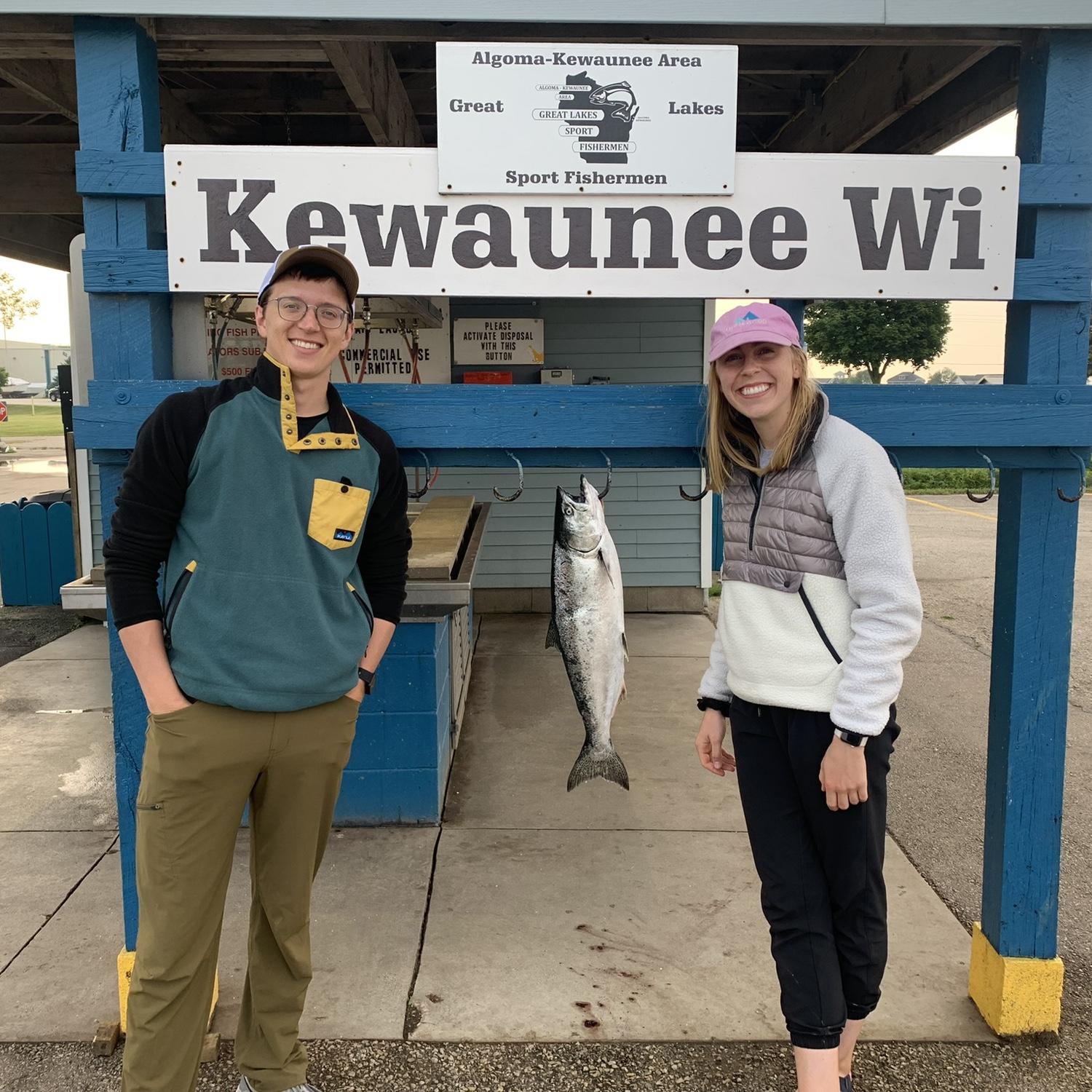 One of the groom's favorite TV quotes is "The sea was angry that day my friend..."
Ironically, Lake Michigan was pretty angry this day so both of us were seasick during this photo of Ellen's catch.