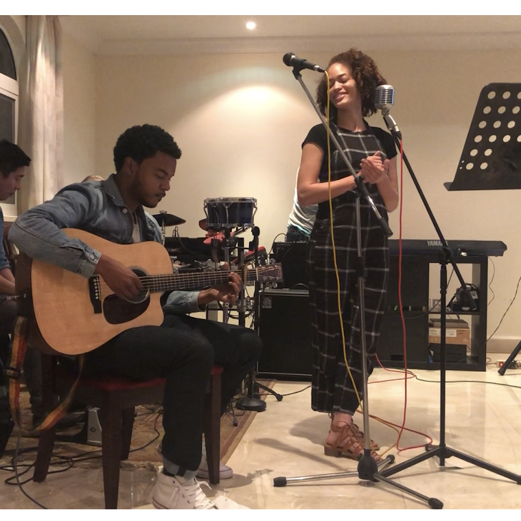 Lauren & Clinton preforming at an open mic in the Middle East.